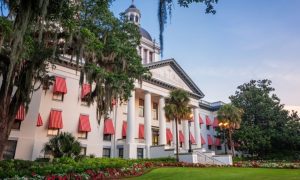 White Building with Red/White Stripe Window Covers on Florida's State Capitol Building