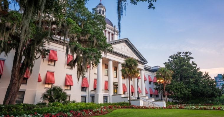 White Building with Red/White Stripe Window Covers on Florida's State Capitol Building
