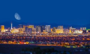 Entire Cityscape of Las Vegas Nevada, with the Moon Over it at Night
