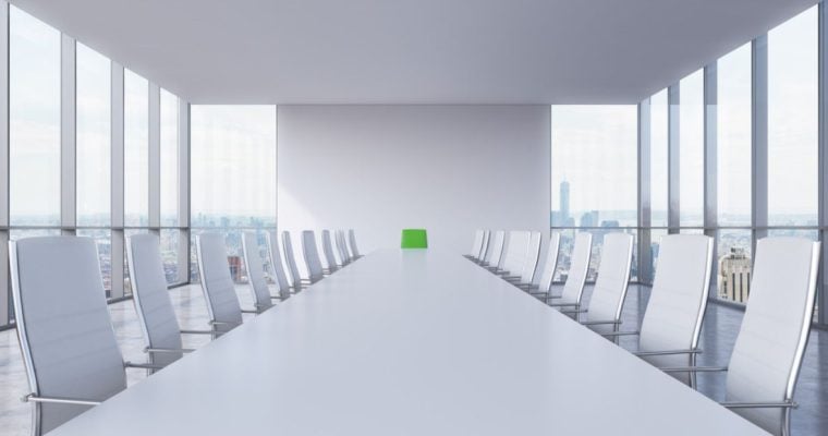 Sterile White Office with White Chairs and Floor-to-Cieling Windows of Cityscape View