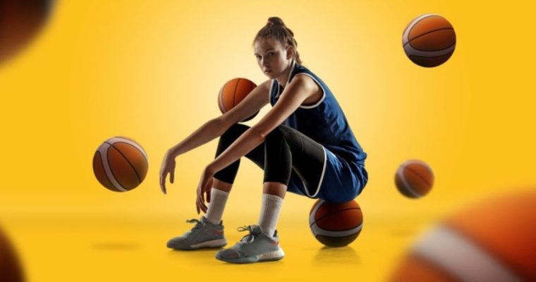 Female Basketball Player Sitting on Ball with Basketballs around on Yellow Background
