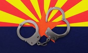 Steel Handcuffs Sit On Top of Arizona State Flag