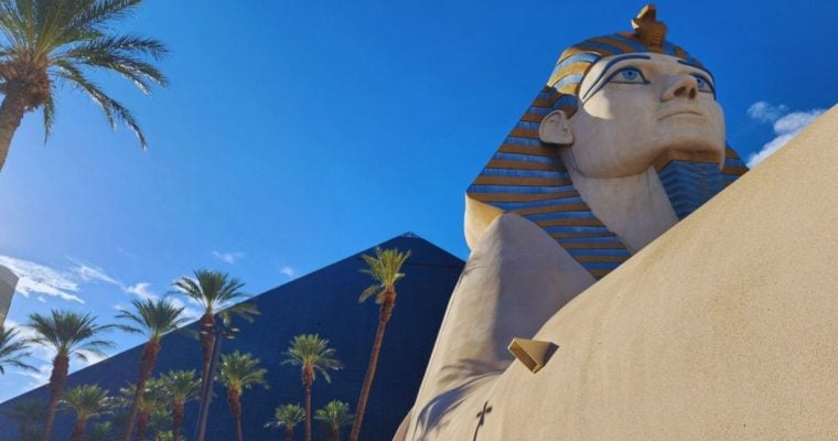 Las Vegas' Luxor Hotel with Black Pyramid and Sphinx Against Blue Sky