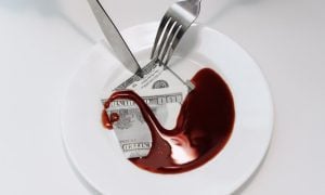 White Plate with $100 Bill in Blood and Fork and Knife