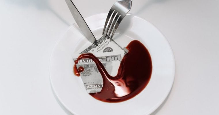 White Plate with $100 Bill in Blood and Fork and Knife