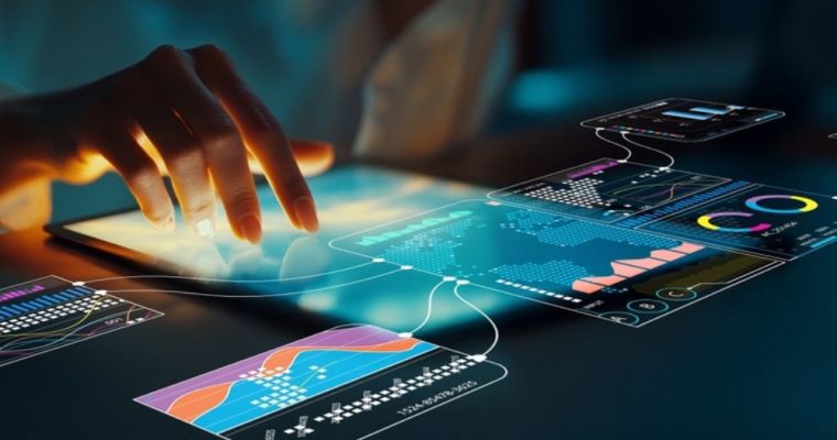 Woman Touches Tablets on Table Displaying Various Data Sets and Graphs