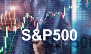 Red & Green Candlestick Graph with S&P 500 Digital Overlay on Image of Man Touching Grid Screen