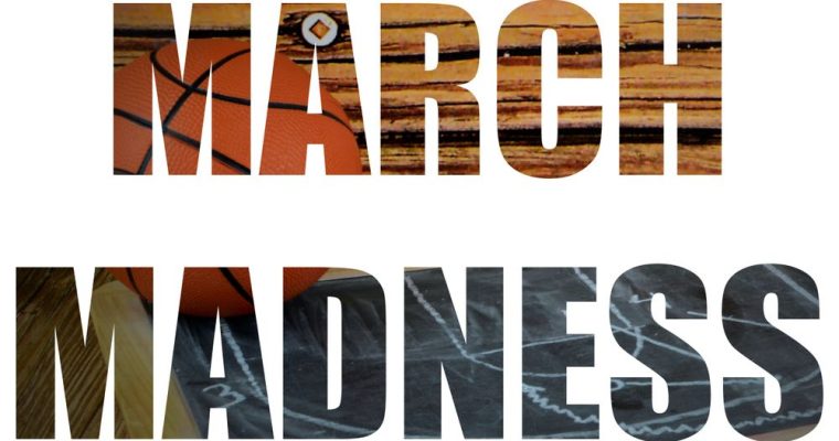 Image of Basketball on Wood Court Sitting Next To Chalkboard Fills Letters Reading March Madness