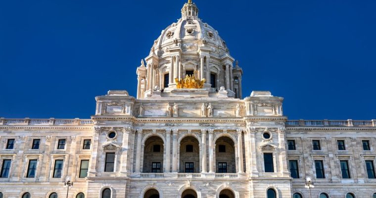 Close Up of the top of Minnesota's State Capitol Building with Blue Sky Behind