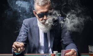 NJ governor urges lawmakers to settle the casino smoking ban question.
