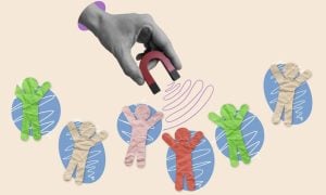 Human Paper Figures And Hand Holding Magnet Attracting Them