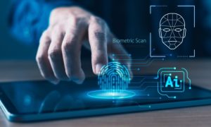 Man Touches Tablet With Digital Image Overlay of Fingerprint, Facial Scan and AI Icon