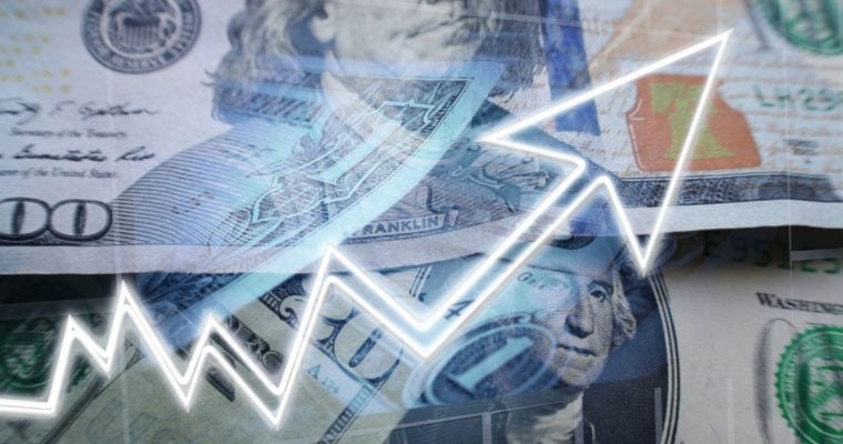 Close Up of Overlapping US Banknotes with Neon White Financial Market Arrow Overlay
