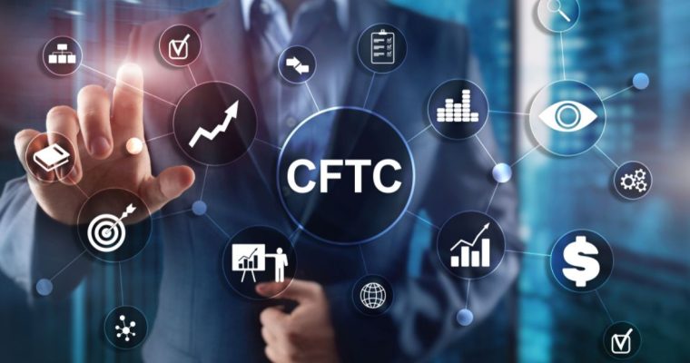Man in Suit Touches Digital Screen with CFTC and Other Icons