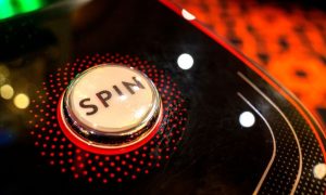 Red, Black and White Spin Button on a Casino Game Machine