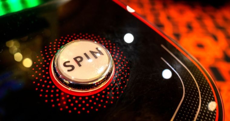 Red, Black and White Spin Button on a Casino Game Machine