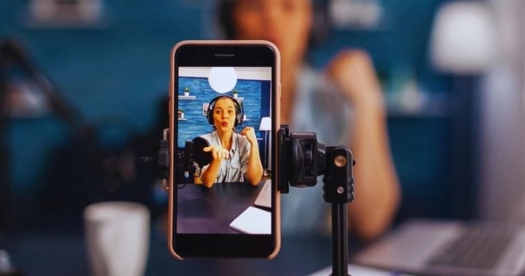 Young Woman as Online Influencer Records a Video Using Smartphone