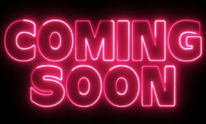 Partially Lit Electric Pink Neon Sign Says Coming Soon