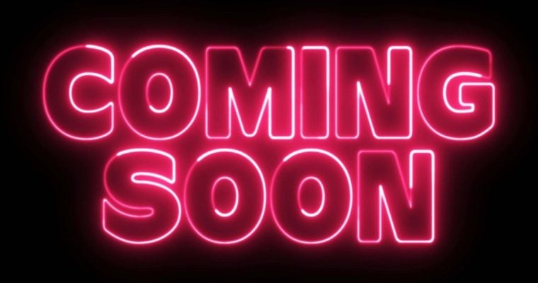 Partially Lit Electric Pink Neon Sign Says Coming Soon