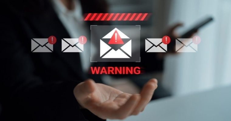 White Envelope with Warning Icon Hovers Above Open Palm