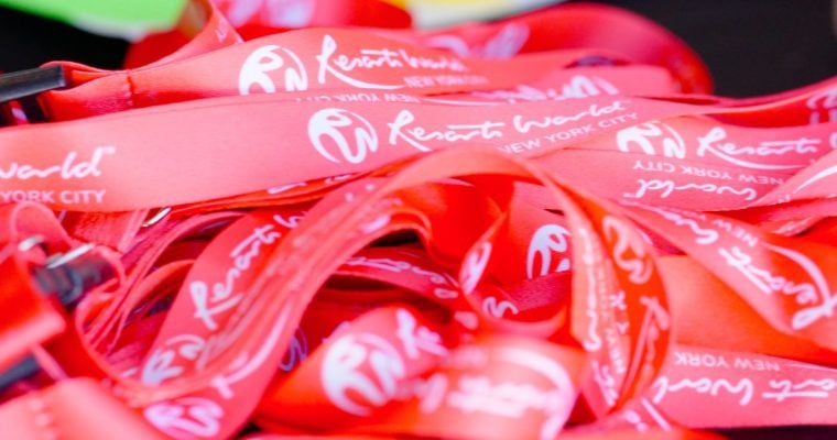 Bright Red Orientation Bracelets Stacked on a Table at Resorts World New York City