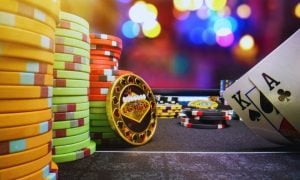Casino Lights in Background of a High-Stakes Poker Game Featuring Stacks of Colorful Chips