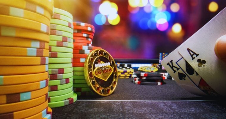 Casino Lights in Background of a High-Stakes Poker Game Featuring Stacks of Colorful Chips