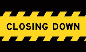 Caution Tape Reads Closing Down on Black Background