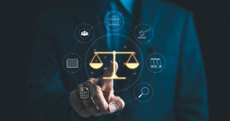 Golden Scales Of Justice Overlay Image Of Man In A Suit Pointing to It