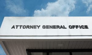 Building Facade Reads Attorney General Office in Dark Grey Letters
