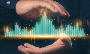 Green and Red Digital Bar Graph Hovers In Between Man's Hands