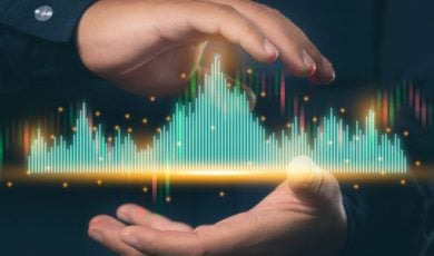 Green and Red Digital Bar Graph Hovers In Between Man's Hands