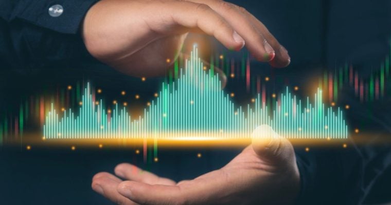 Green and Red Digital Bar Graph Hovers In Between Man's Hands
