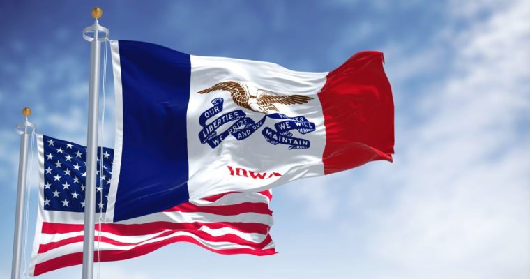Blue Skies and Iowa State Flag Waving In Front Of US Flag