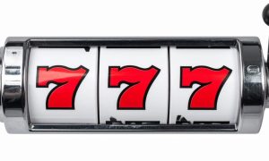 Old School Silver Slot Reel Reads 777 in Red