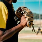 Sunny Day on an Outdoor Baseball Field with Close Up of Pitcher Gearing Up for a Pitch