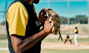 Sunny Day on an Outdoor Baseball Field with Close Up of Pitcher Gearing Up for a Pitch