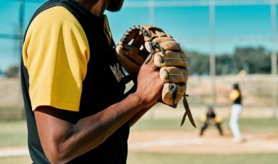 Sunny Day on an Outdoor Baseball Field with Close Up of Pitcher Gearing Up for a Pitch
