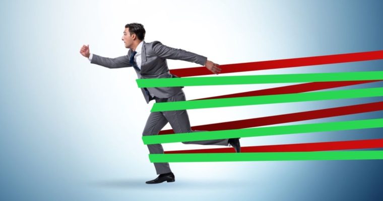 Red and Green Bands Hold Running Man In Gray Suit