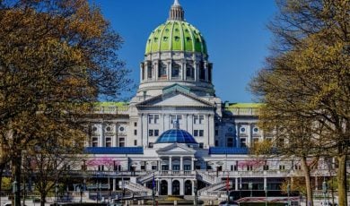 Autumn Trees Surround The Capital Building in Pennsylvania with Blue Skies Background