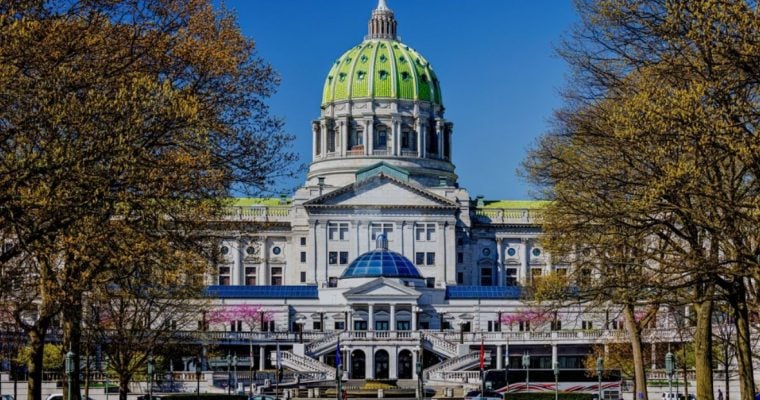 Autumn Trees Surround The Capital Building in Pennsylvania with Blue Skies Background