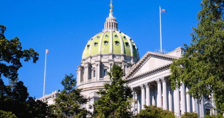 Green Trees and Blue Sky Surround the Capitol Building in Pennsylvania
