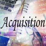 Stock Numbers, Notebook, Glasses and Laptop Background to the Word Acquisition in Black Font