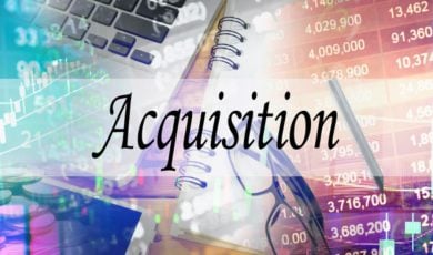 Stock Numbers, Notebook, Glasses and Laptop Background to the Word Acquisition in Black Font