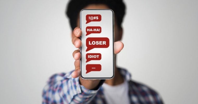 Negative Messages Displayed on Man's Cell Phone Covering His Face