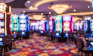 Blurry Image of Colorful Slot Machines on Casino Floor