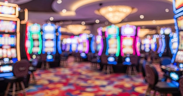 Blurry Image of Colorful Slot Machines on Casino Floor