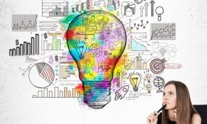 Sketched Light Bulb Above Woman's Head Contains Images Of Mathematics and Statistics