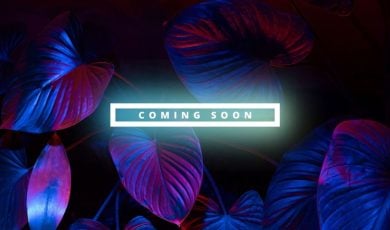 Red and Blue Lights Highlight Plant Foliage with White Neon Coming Soon Text