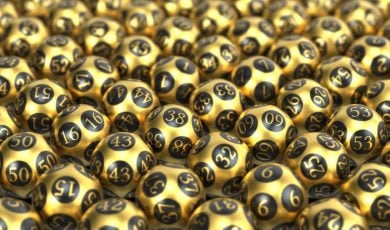 Table Filled from End to End with Golden Mega Millions Lottery Balls